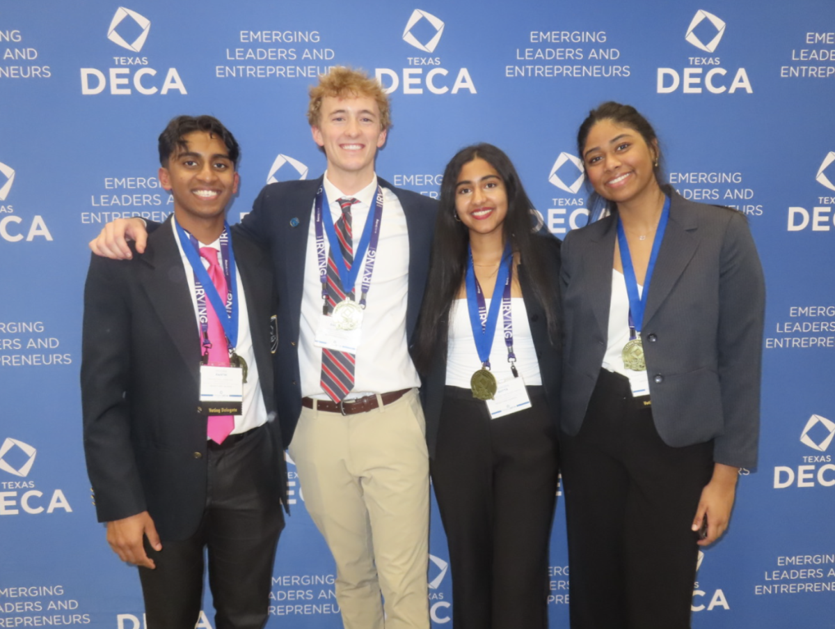 Seniors Sahasra Gutta, Siddha Kanthi, Charlie Goldberg, and Preethi Chunduri posing for a photo together after qualifying for the state DECA competition. They each prepared for the competition in different ways but are equally excited for the state competition. 